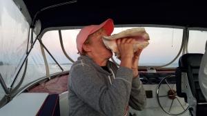 Cathy blowing the conch